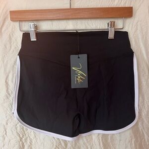 Black and White Athletic Shorts with Retro Dolphin Hem